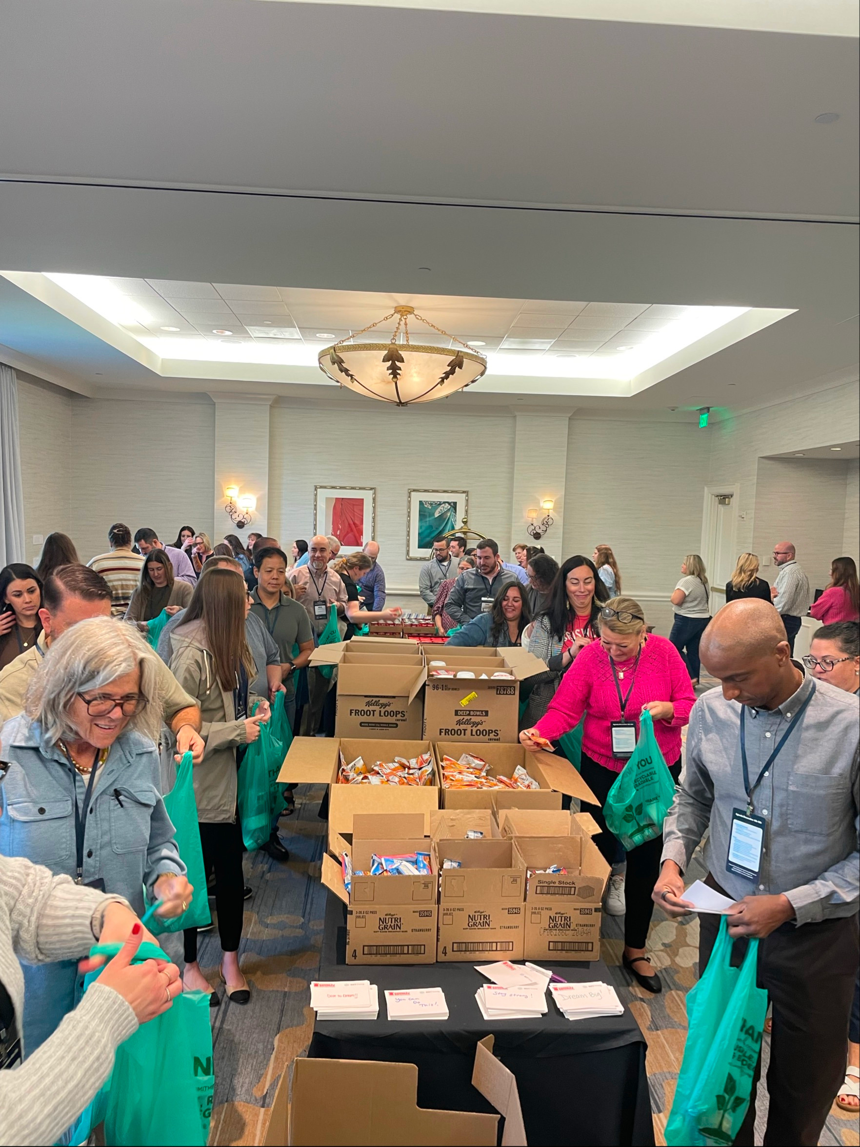 NXTThing colleagues packing food donations for the community